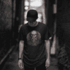 t shirt mockup of a cool man posing in a dark alley 2357 el1 - Varegue