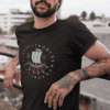 cropped face tattooed man wearing a t shirt mockup while lying against a fence on a rooftop a17027 - Varegue