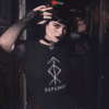 tee mockup featuring a goth woman at a dark alley wearing fishnet arm warmers 26609 - Varegue