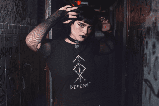 tee mockup featuring a goth woman at a dark alley wearing fishnet arm warmers 26609 - Varegue